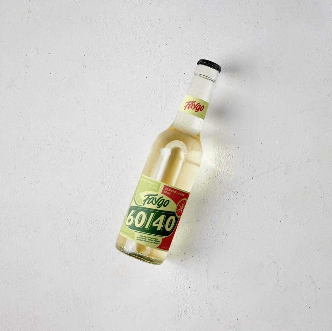 A 300 mL glass bottle with the 60/40 body label and the Faygo neck label, from the front