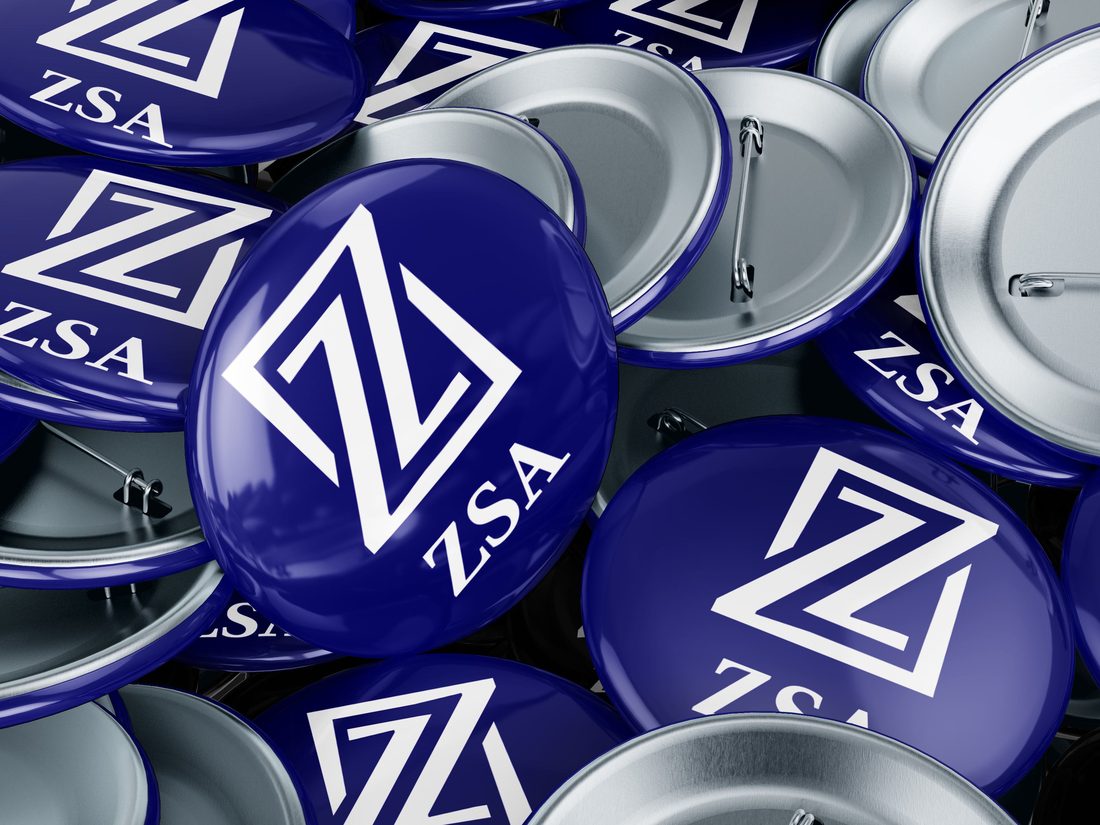 A pile of navy badges with the Z mark and wordmark