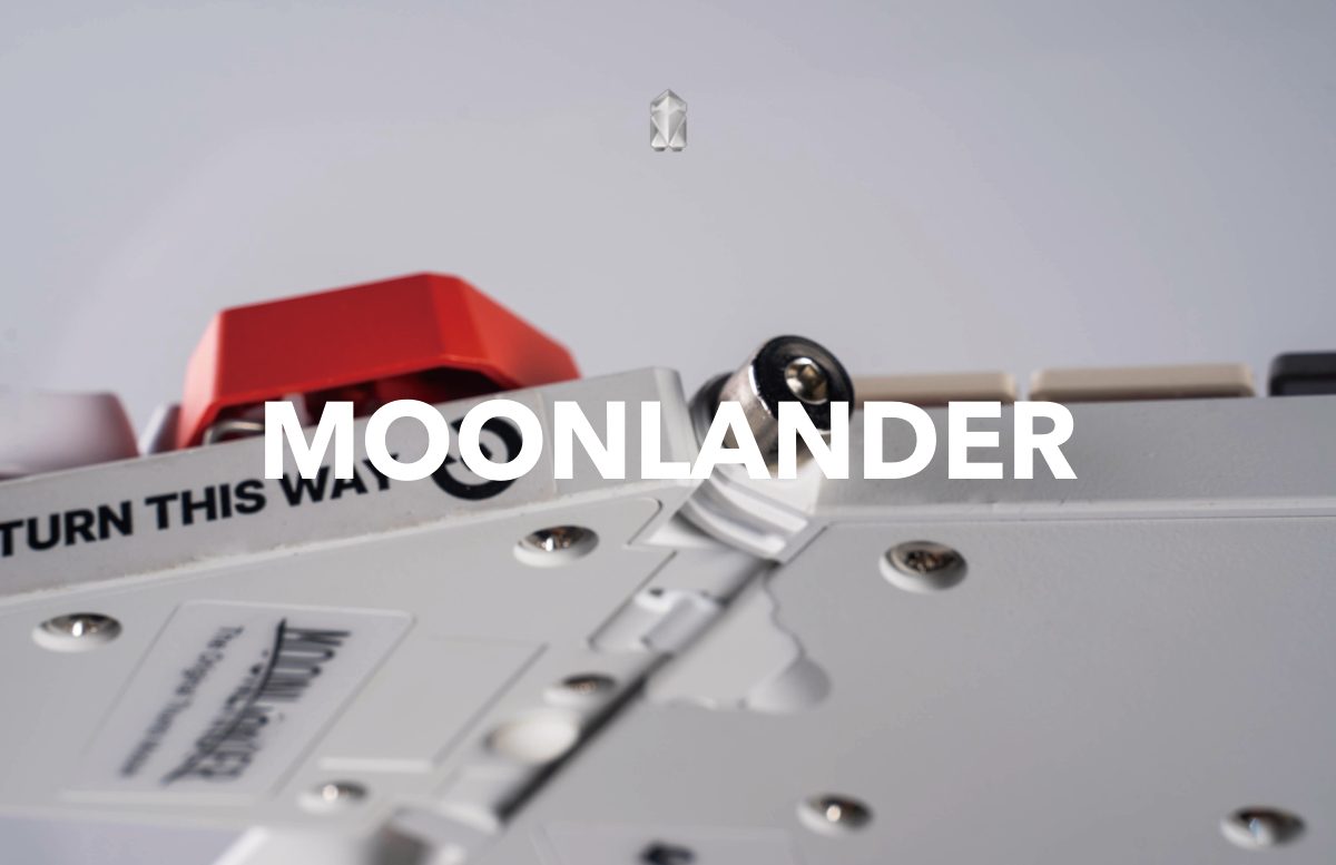 Low view of the keyboard’s underside and a red keycap, with the word Moonlander